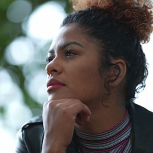 Pensive black woman thinking about life outside. Contemplative thoughtful person