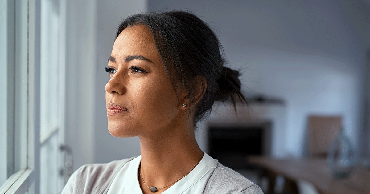 A woman figuring out how she's going to tell her family that she's pregnant